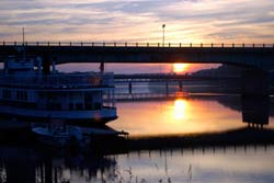 Bangor bridge and boat at sunset